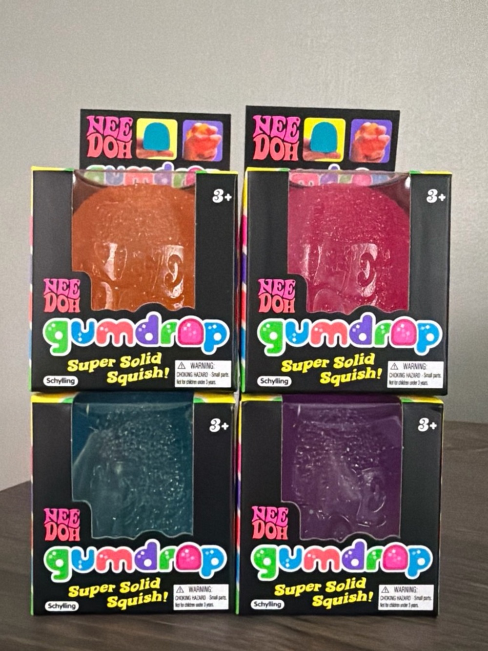 NeeDoh Gumdrop Super Solid Squish! Set of 4- Blue, Pink, Orange, Purple